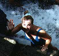 Waving while climbing the falls