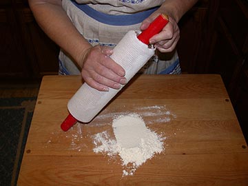 Dusting the rolling pin with flour